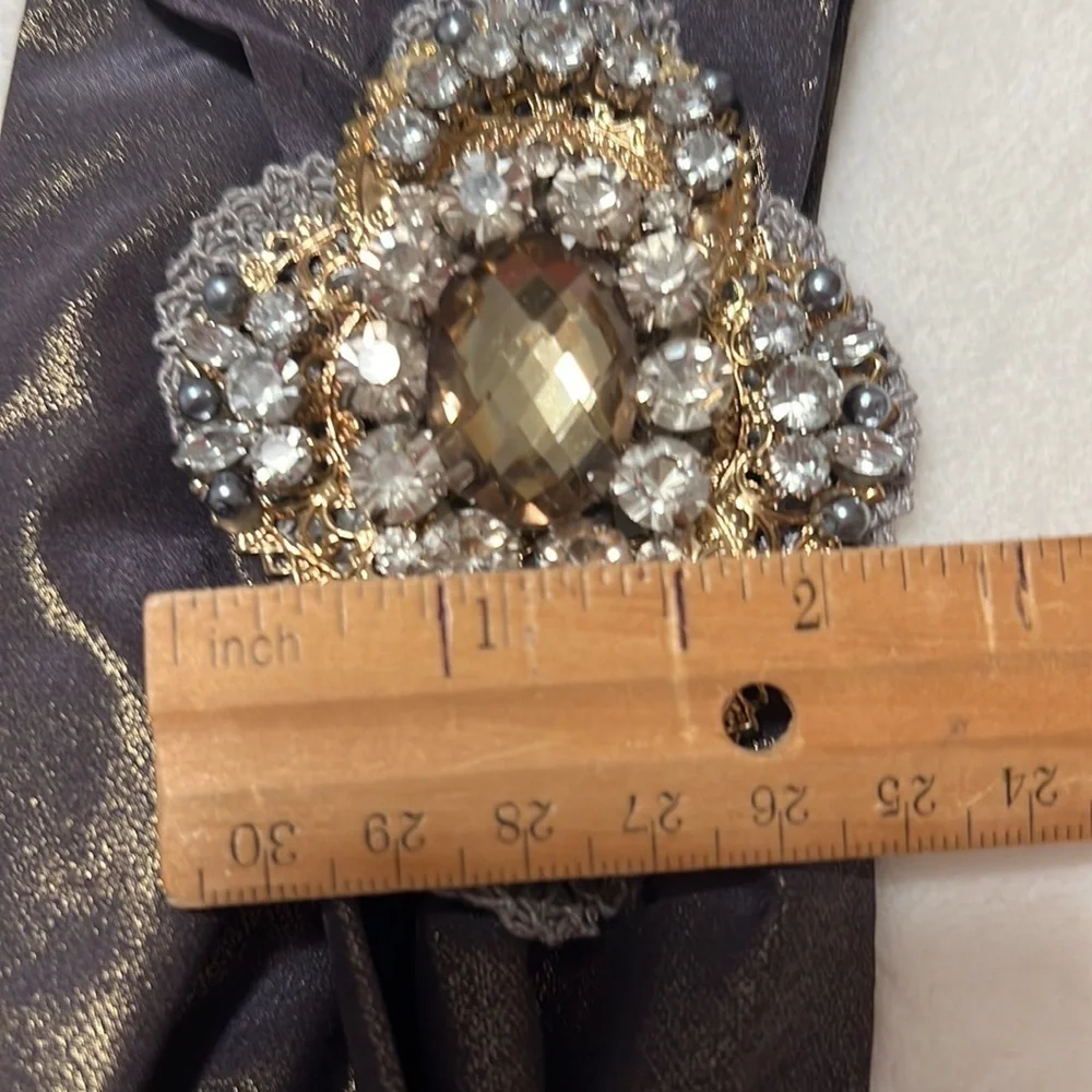 Headband, sparkling fabric and stunning brooch